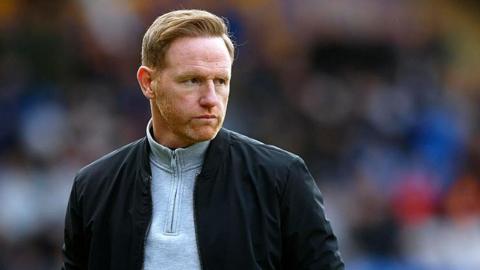 Shrewsbury Town head coach Gavin Cowan watches on during a game