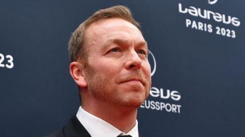 A close-up of Sir Chris Hoy on a red carpet