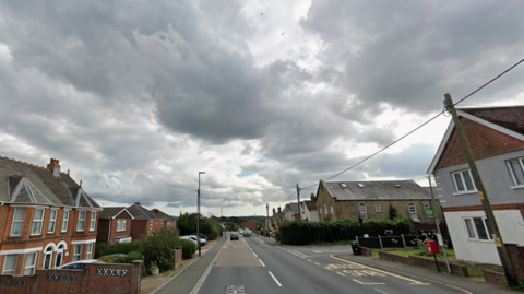 Horsebridge Hill road with houses along both sides.