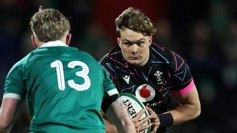 Dom Kossuth carries the ball for Wales Under-20s against Ireland in Cork