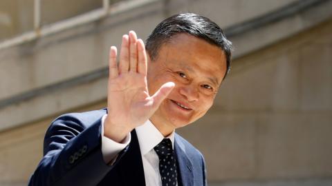 Jack Ma waves at the camera