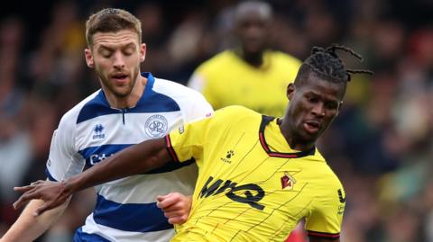 Watford's Vakoun Issouf Bayo battles for the ball against Queens Park Rangers' Liam Morrison