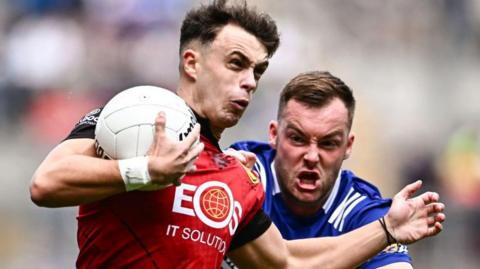 Kilcoo and Down player Shealan Johnston protects the ball the county's Tailteann Cup win over Laoisduring 