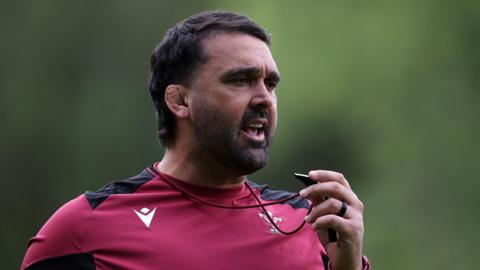 Jonathan Thomas with a whistle