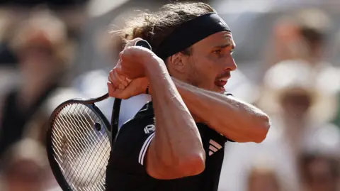 Alexander Zverev hits a backhand