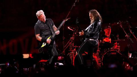Metallica play on stage during one of their concerts