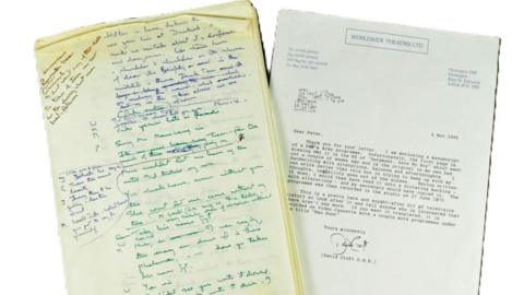 A picture of the handwritten script in a mix of blue and green pen and a printed letter 