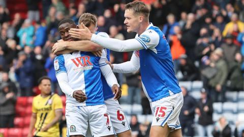 Augustus Kargbo surrounded by his teammates after scoring for Blackburn. 