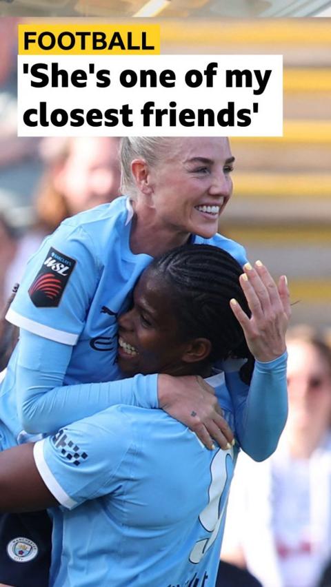 Alex Greenwood hugs team-mate Khadija Shaw