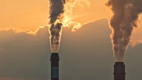 Smoke rises from two chimneys in eastern China