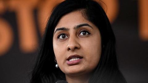 Zarah Sultana speaks from the stage in Parliament Square during a protest against the State Visit of US President Donald Trump