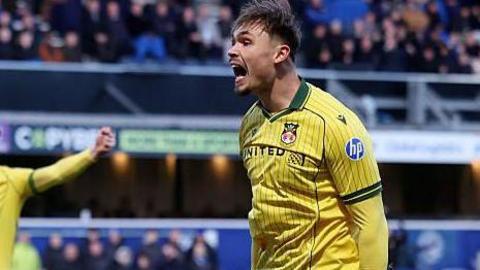 Callum Doyle had not scored in 19 appearances for Wrexham since joining from Manchester City in August 2025 Alternative description Callum Doyle in yellow celebrates for Wrexham with teammate Kieffer Moore in the background and a QPR player on the floor