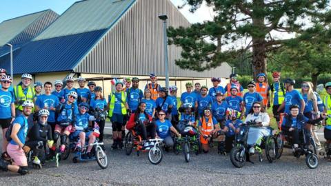 The group of skaters and wheelchair users