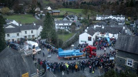 Crowds welcome Bluebird as it arrives in Coniston on 9 March