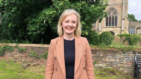 Liz Truss standing by Emneth Church in West Norfolk 