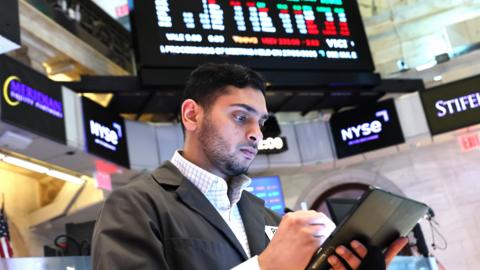 A trader works on the floor of the New York Stock Exchange