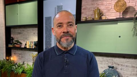 An image of preseter Kev Duala in the Morning Live Studio.