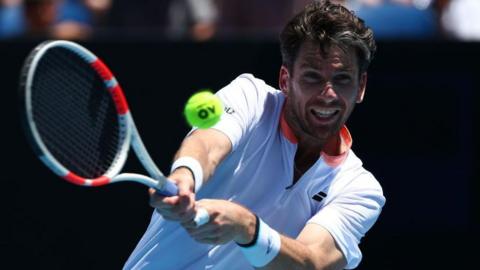 Cameron Norrie plays a backhand at the Australian Open