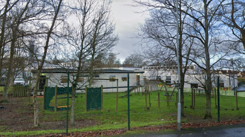 Some of the buildings and memorial garden at Trench Road Primary School in Derry