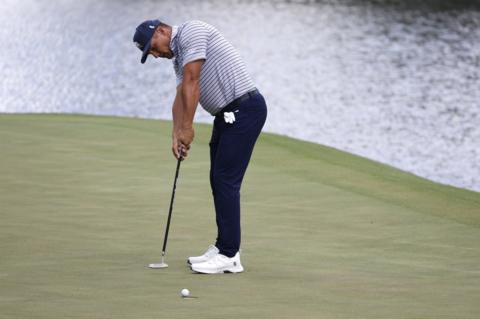 Bryson DeChambeau holes a putt at the 16th hole during the Masters first round