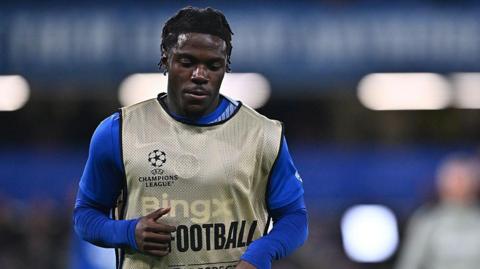 Romeo Lavia warming up before a Champions League match against Ajax