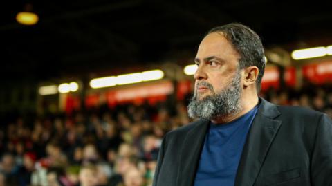 Nottingham Forest owner Evangelos Marinakis watches his club in action at the City Ground