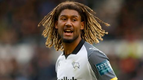A close-up of Dion Sanderson playing for Derby County in their home shirt