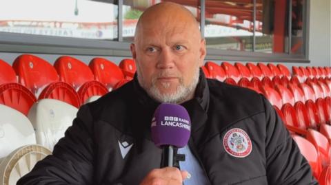 Accrington Stanley CEO Warren Eastham talking to BBC Radio Lancashire
