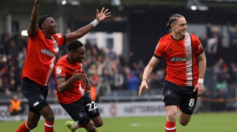 Luton Town players celebrate with Thelo Aasgaard
