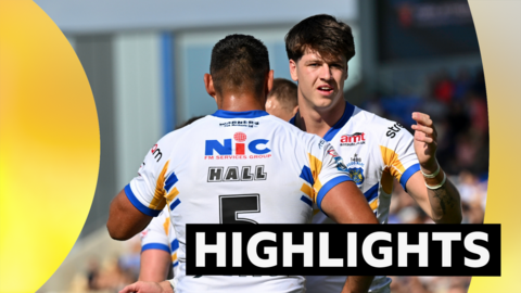 Leeds players hug next to the word highlights