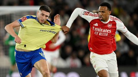 Gabriel pulls a shirt