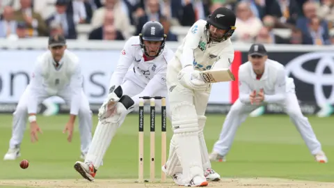 New Zealand batter Devon Conway plays a shot
