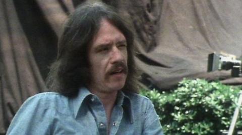 John Carpenter talking during the interview.