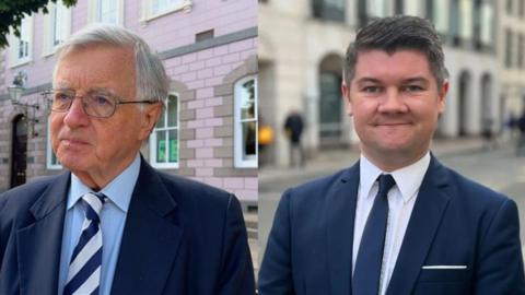 Deputies Sir Philip Bailhache and Sam Mezec both wearing blue suits and light coloured shirts. 