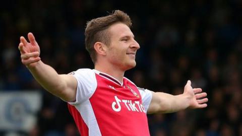 Paul Mullin with outretched arms celebrates a goal for Wrexham in 2021