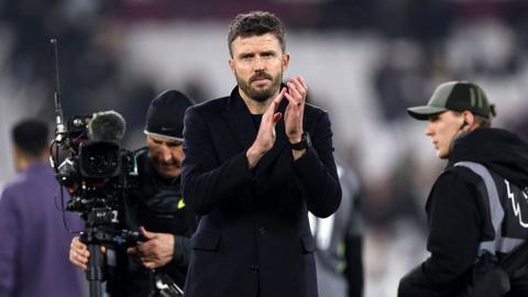 Michael Carrick applauds Manchester United fans following the full-time whistle at West Ham.