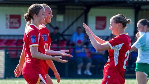Gwalia players including goal-scorer Molly Kehoe celebrate after taking the lead.