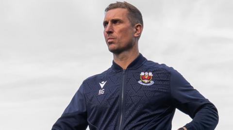 Rhys Griffiths looks on from the touchline