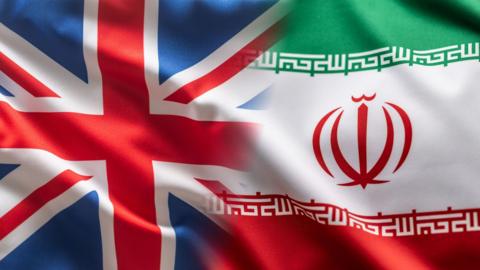 A flag of the UK and a flag of Iran