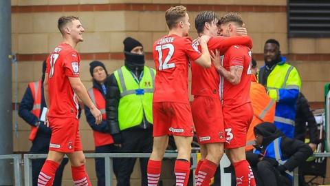 Leyton Orient players celebrate with goalscorer Charlie Kelman