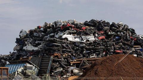 Scrapped vehicles at a scrap and metal recycling yard in Wilhelmshaven, Germany, on Friday, May 2, 2025