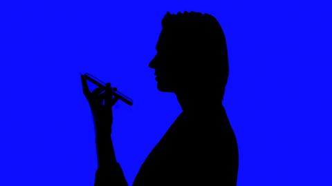 Cutout of a woman speaking to a mobile phone