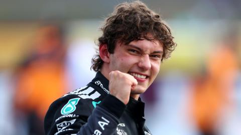 Mercedes' Kimi Antonelli smiles and clenches his fist in celebration after taking pole position for the British Grand Prix