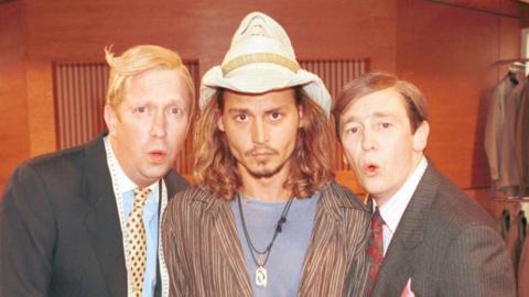 Mark Williams, Johnny Depp and Paul Whitehouse in the suits you sketch from the Christmas 2000 special - Williams and Whitehouse are in their black suits, Depp wears a Stetson hat, a striped shirt and a blue T-shirt. Williams and Whitehouse are making an "Oooh" face.