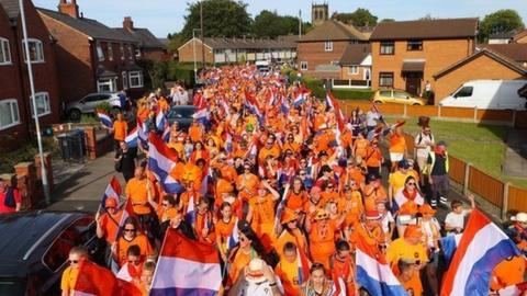 Netherlands fans walking to Leigh Sports Village for the Euro 2022 match with Portugal