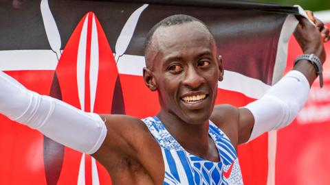 Oct 8, 2023; Chicago, IL, USA; Kelvin Kiptum (KEN) celebrates after finishing in a world record time of 2:00:35 to win the Chicago Marathon