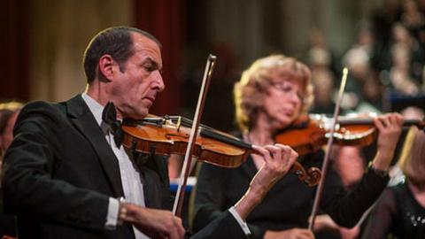 Dominic Hopkins playing violin with in Norwich Philharmonic