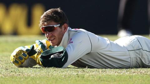 Australia captain Tim Paine lies on the floor after dropping a catch on day five of the third Test against India