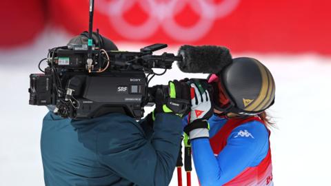 Sofia Goggia of Italy kisses a TV camera at National Alpine Ski Centre