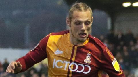 Oscar Threlkeld in action during a League Two match between Barrow and Bradford City at Holker Street, Barrow-in-Furness in January 2022